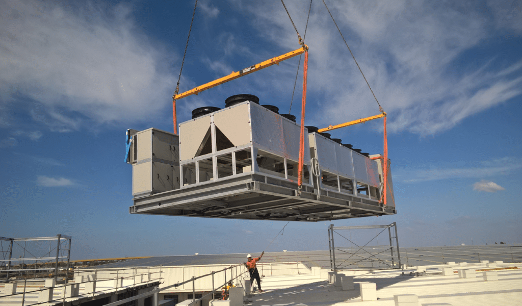 Industrial refrigerators being lifted by a crane | AHU & HVAC Refrigeration