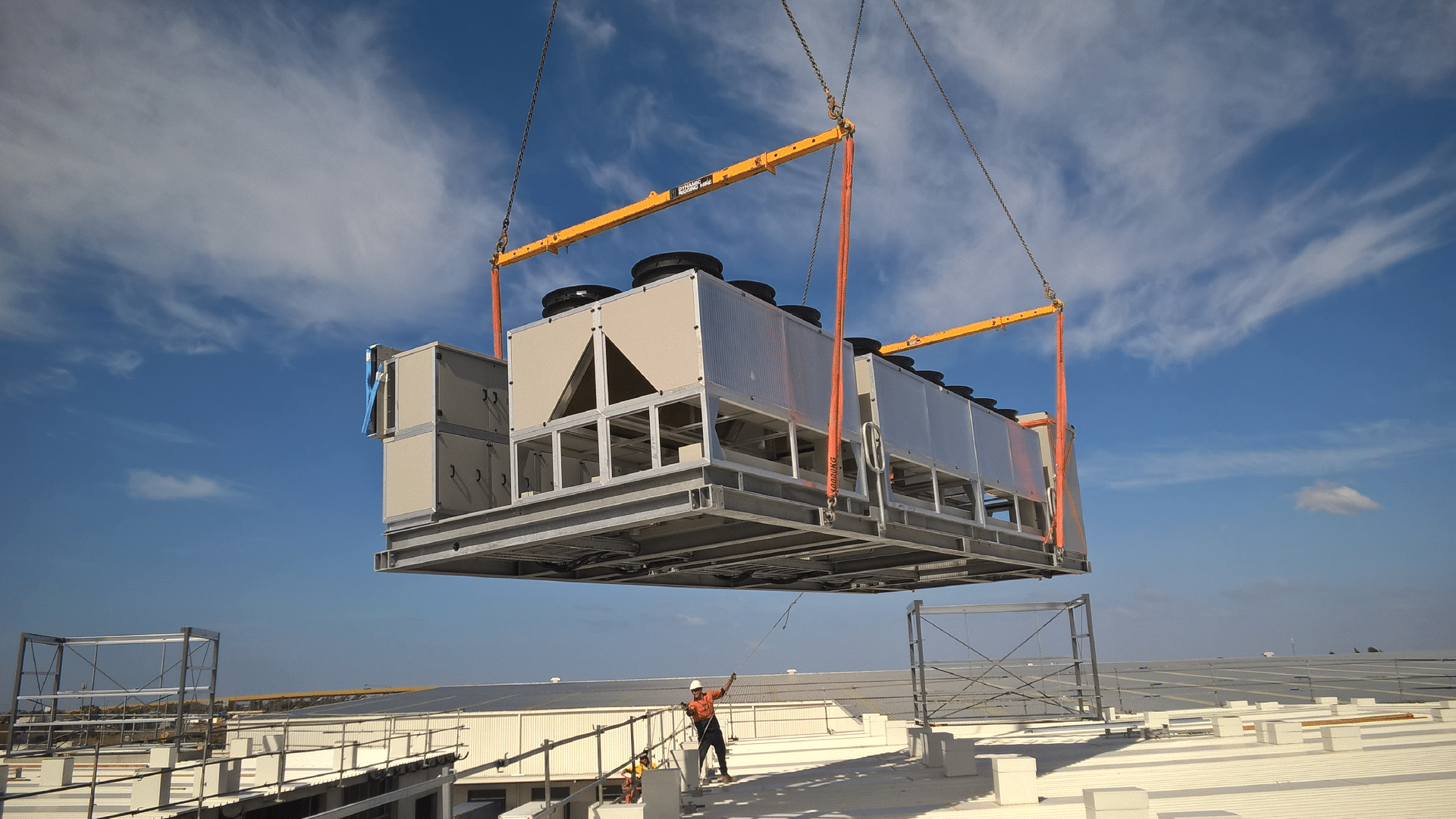 Industrial refrigerators being lifted by a crane
