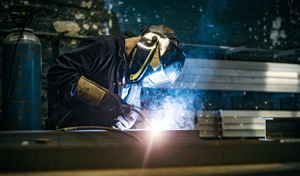 Factory Image, factory working welding metal with sparks