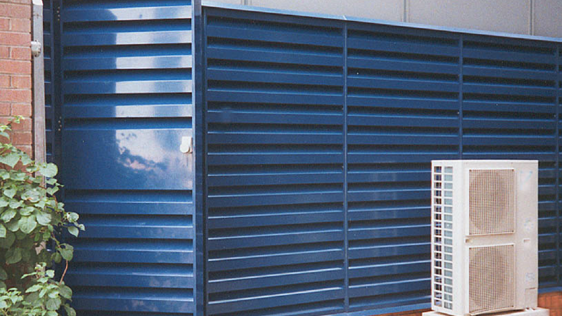 Blue Acoustic Louvres & Louvred Barriers on the side of a building